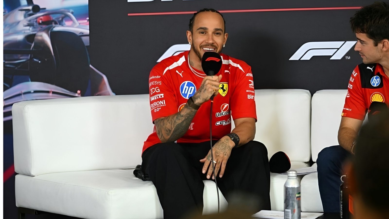 Ferrari Power Unit Mystery: Hamilton Frustrated by Performance Gap to Leclerc at Suzuka 1 Lewis Hamilton and Charles Leclerc in Ferrari team gear at the 2026 Japanese Grand Prix race press conference discussing SF-26 power unit performance.