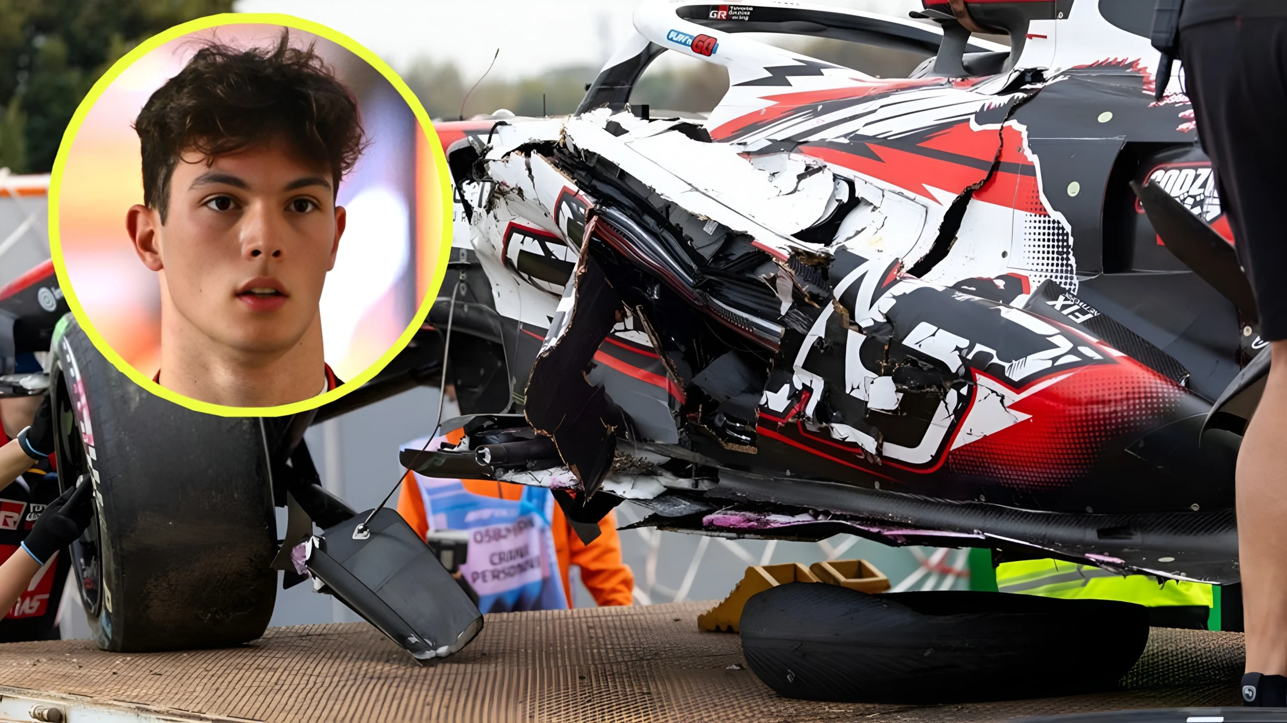 Wrecked Haas VF-26 sidepod of Oliver Bearman on a flatbed recovery truck at Suzuka Circuit following a 50G impact caused by 2026 F1 powertrain energy harvesting differentials.