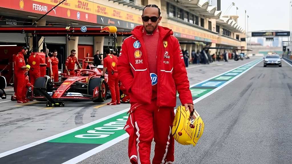 The Prancing Horse Reimagined: Technical Analysis of Lewis Hamilton’s 2026 Adaptation at Ferrari 1 Lewis Hamilton wearing red Ferrari race suit and jacket carrying yellow helmet in F1 paddock during 2026 season